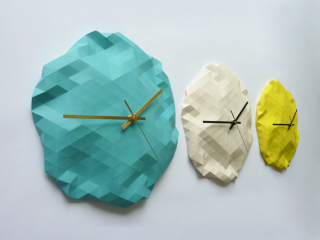 Illustration for article titled Origami-Inspired Clocks So Attention-Grabbing, You'll Never Run Late
